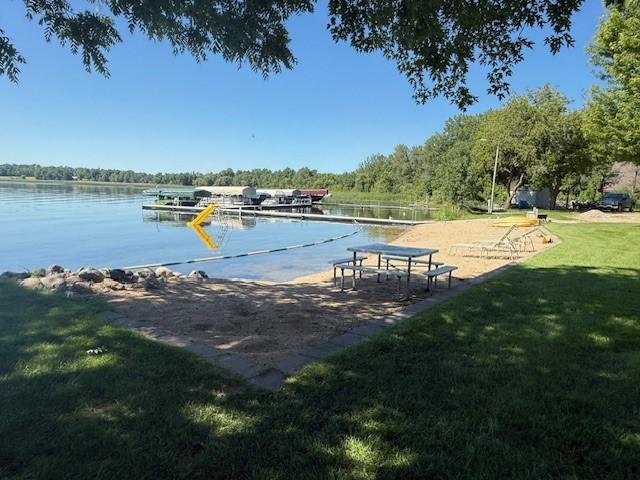 5055 Lake Mary Dr SW Unit 18, Alexandria, MN 56308 - dock featuring a yard and a water view