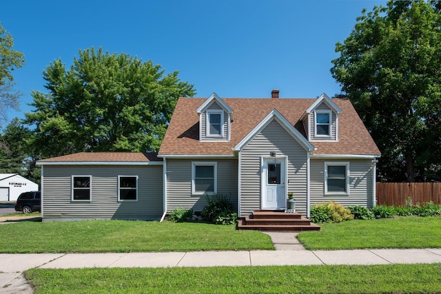 202 Silver St E, Mapleton, MN 56065 - cape cod-style house with a chimney and a shingled roof