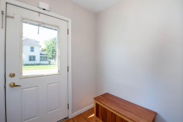 202 Silver St E, Mapleton, MN 56065 - doorway to outside featuring baseboards