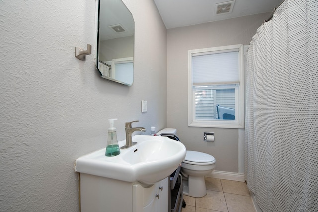 202 Silver St E, Mapleton, MN 56065 - bathroom with vanity, tile patterned flooring, and a shower with curtain