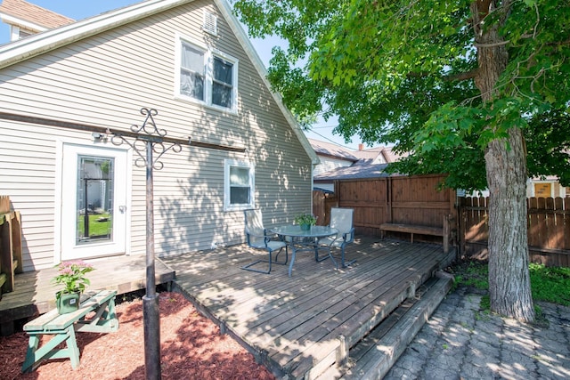 202 Silver St E, Mapleton, MN 56065 - wooden terrace with outdoor dining area