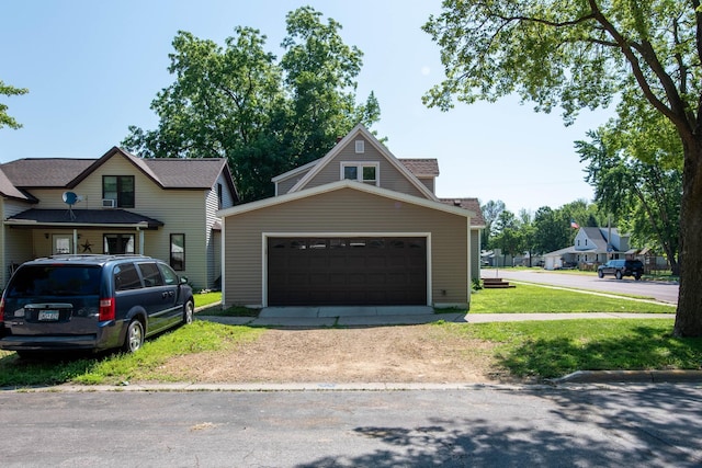 202 Silver St E, Mapleton, MN 56065 - view of front facade featuring driveway and a front lawn