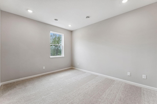 7443 E Ramsey Pkwy NW, Ramsey, MN 55303 - spare room with carpet flooring and recessed lighting