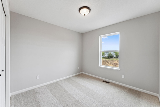 7443 E Ramsey Pkwy NW, Ramsey, MN 55303 - carpeted empty room featuring baseboards