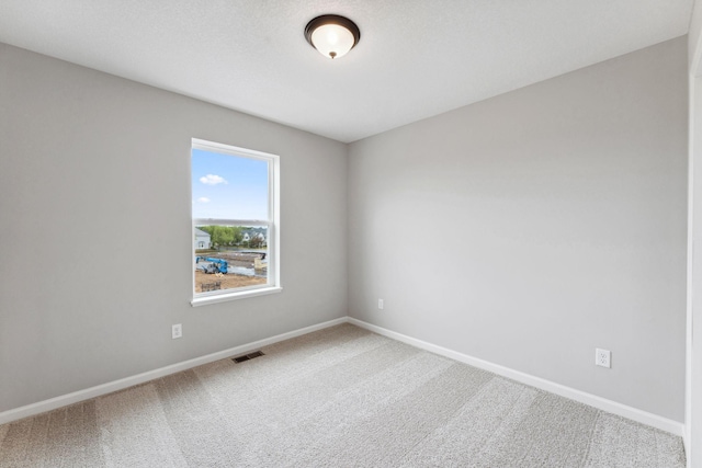 7443 E Ramsey Pkwy NW, Ramsey, MN 55303 - unfurnished room with carpet floors and baseboards