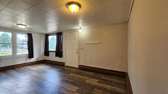 625 2nd Ave NE, Staples, MN 56479 - empty room featuring a baseboard heating unit and dark wood-type flooring