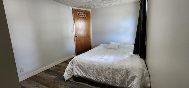 625 2nd Ave NE, Staples, MN 56479 - bedroom with a textured ceiling and wood finished floors