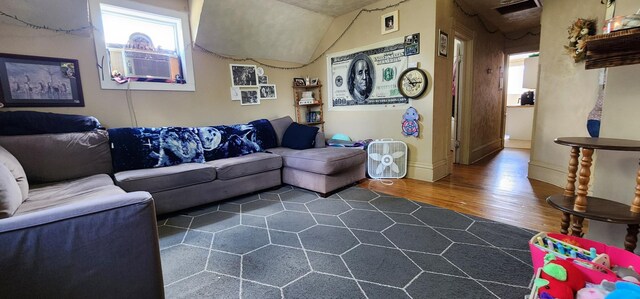 625 2nd Ave NE, Staples, MN 56479 - living room featuring dark wood-style floors, plenty of natural light, and cooling unit