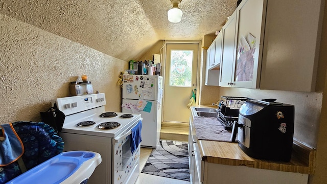 625 2nd Ave NE, Staples, MN 56479 - kitchen featuring white appliances, a textured wall, butcher block counters, vaulted ceiling, and a textured ceiling