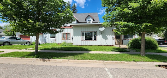 625 2nd Ave NE, Staples, MN 56479 - view of property hidden behind natural elements with a front lawn and board and batten siding