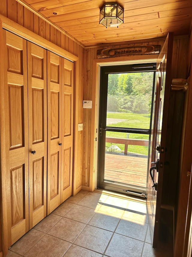 1938 Pine Cliff Rd NW, Walker, MN 56484 - foyer entrance featuring light tile patterned flooring, wood ceiling, and wood walls
