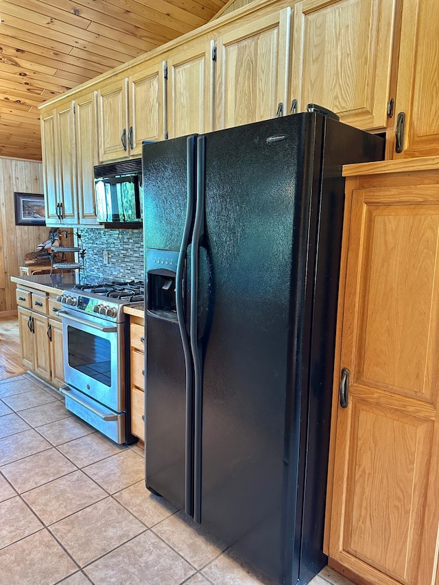 1938 Pine Cliff Rd NW, Walker, MN 56484 - kitchen with black appliances, wooden ceiling, light tile patterned flooring, light brown cabinets, and wooden walls