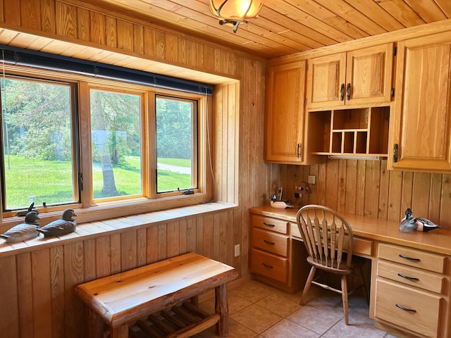 1938 Pine Cliff Rd NW, Walker, MN 56484 - office area featuring built in study area, light tile patterned floors, wood walls, and wooden ceiling