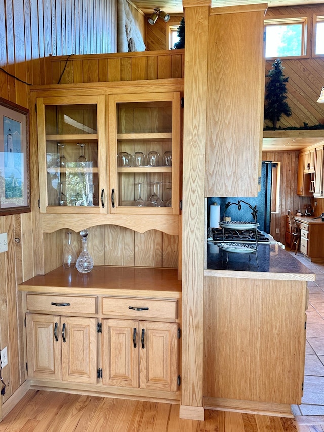 1938 Pine Cliff Rd NW, Walker, MN 56484 - kitchen featuring wooden walls, light brown cabinets, and light wood-style floors