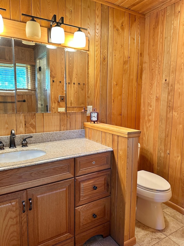 1938 Pine Cliff Rd NW, Walker, MN 56484 - bathroom featuring vanity, wood walls, and tile patterned floors