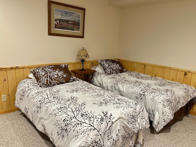1938 Pine Cliff Rd NW, Walker, MN 56484 - carpeted bedroom featuring wainscoting and wooden walls