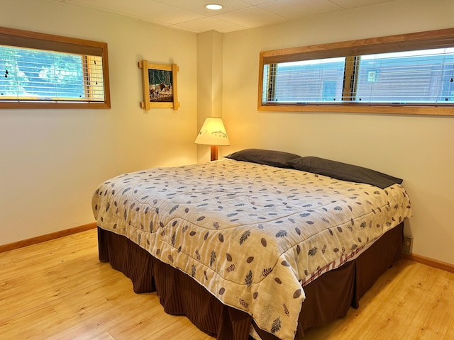 1938 Pine Cliff Rd NW, Walker, MN 56484 - bedroom featuring wood finished floors, multiple windows, and recessed lighting