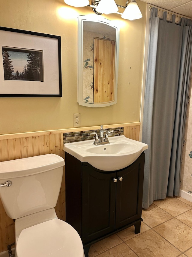 1938 Pine Cliff Rd NW, Walker, MN 56484 - bathroom featuring vanity, a wainscoted wall, and tile patterned flooring
