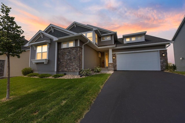 4617 Cobalt Ln, Woodbury, MN 55129 - craftsman house featuring stone siding, asphalt driveway, a yard, and a garage