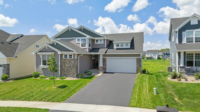 4617 Cobalt Ln, Woodbury, MN 55129 - craftsman house featuring stone siding, asphalt driveway, a front lawn, and a residential view
