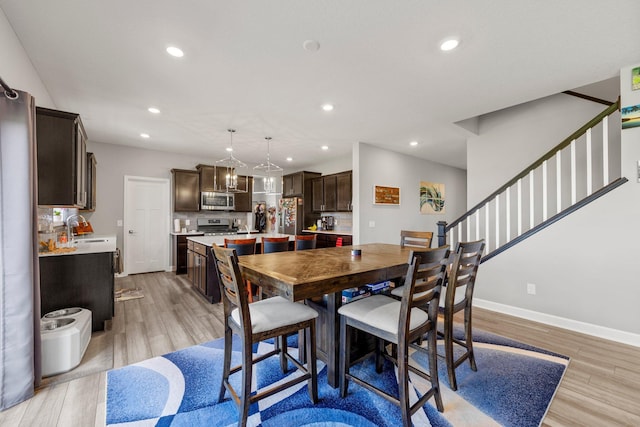 4617 Cobalt Ln, Woodbury, MN 55129 - dining room featuring light wood-style floors, recessed lighting, and stairway