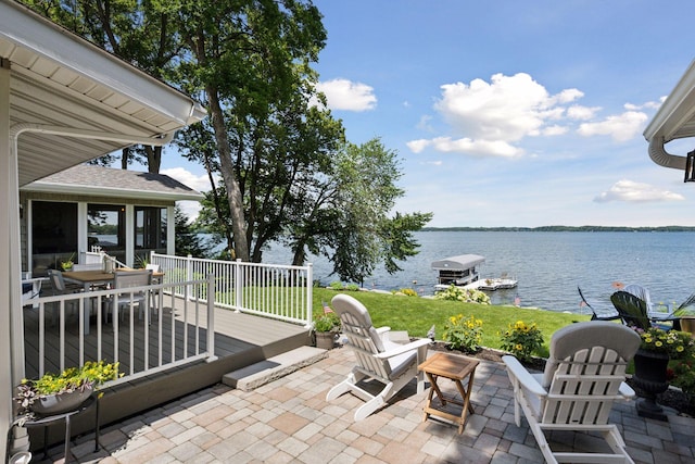 68018 217th St, Ellsworth Twp, MN 55324 - view of patio with a water view, outdoor dining space, and a boat dock