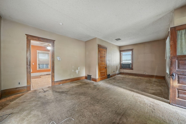 2918 15th Ave S, Minneapolis, MN 55407 - unfurnished living room featuring carpet floors, a textured ceiling, and cooling unit