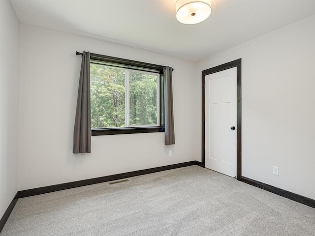 1049 Bellaire Blvd NW, Isanti, MN 55040 - carpeted empty room featuring baseboards