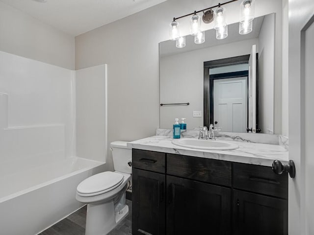 1049 Bellaire Blvd NW, Isanti, MN 55040 - bathroom with vanity, wood finished floors, and tub / shower combination