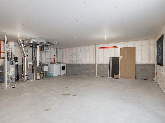 1049 Bellaire Blvd NW, Isanti, MN 55040 - garage with independent washer and dryer, gas water heater, heating unit, and concrete block wall