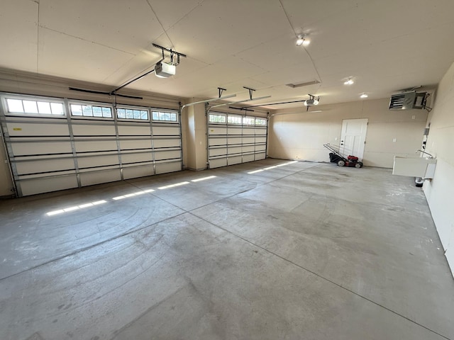 1049 Bellaire Blvd NW, Isanti, MN 55040 - garage featuring a garage door opener