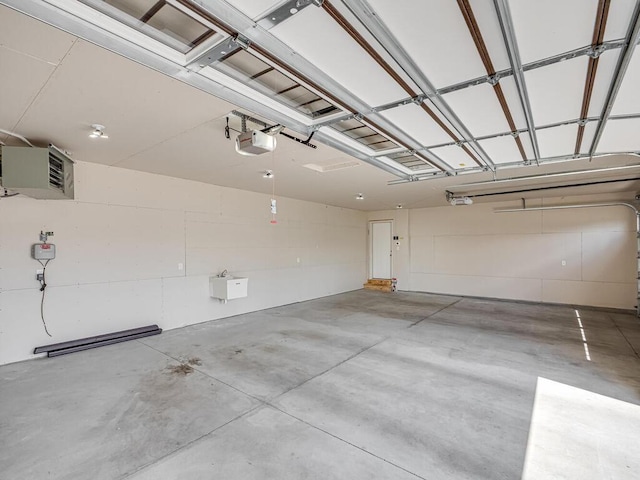 1049 Bellaire Blvd NW, Isanti, MN 55040 - garage featuring a garage door opener and a heating unit