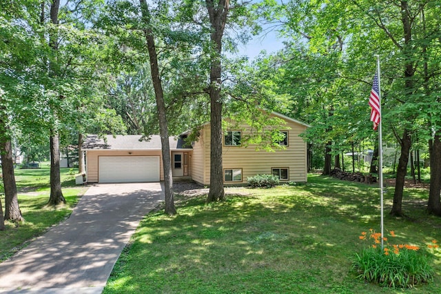 4885 262nd St, Wyoming, MN 55092 - tri-level home featuring driveway, an attached garage, and a front lawn