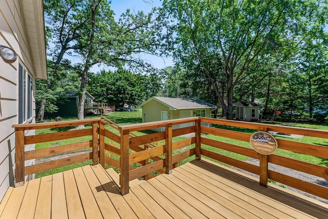 4885 262nd St, Wyoming, MN 55092 - wooden deck featuring a storage unit, a yard, and view of scattered trees