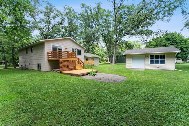 4885 262nd St, Wyoming, MN 55092 - view of grassy yard featuring a wooden deck, a detached garage, and an outbuilding