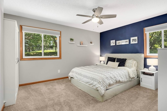 14301 Princeton Ave, Savage, MN 55378 - carpeted bedroom featuring baseboards and a ceiling fan