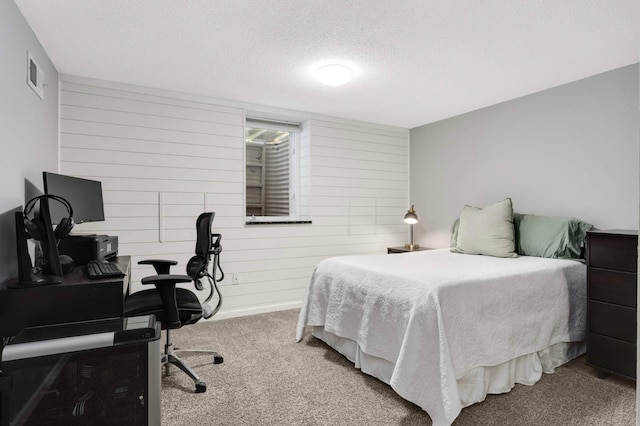 14301 Princeton Ave, Savage, MN 55378 - bedroom with carpet flooring, a textured ceiling, an office area, and wood walls