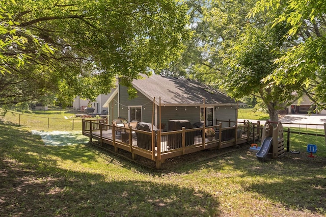 14301 Princeton Ave, Savage, MN 55378 - back of property featuring a fenced backyard, a wooden deck, and roof with shingles