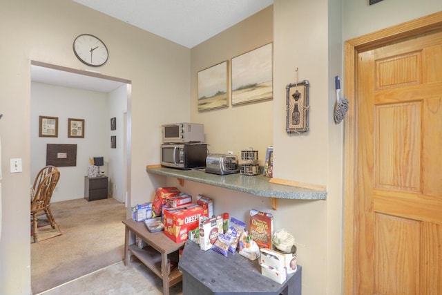 850 22nd Ave SE, Minneapolis, MN 55414 - kitchen with carpet floors and stainless steel microwave
