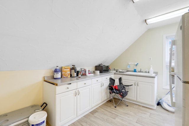 850 22nd Ave SE, Minneapolis, MN 55414 - home office with light wood-style floors and vaulted ceiling