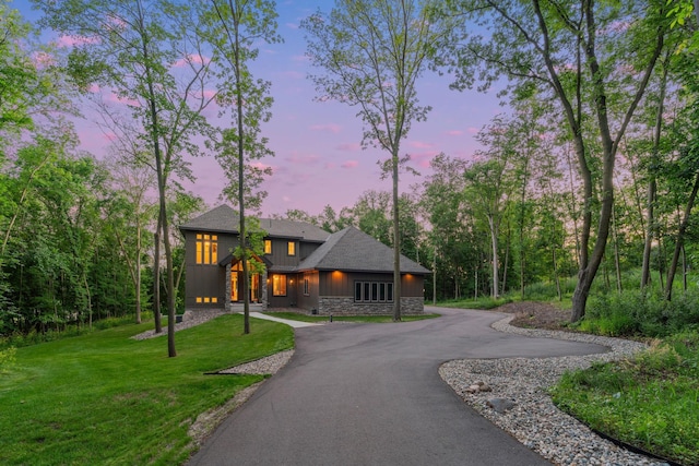 21386 Dorothy Way, Spring Lake Twp, MN 55372 - prairie-style house featuring board and batten siding, curved driveway, a front lawn, and stone siding