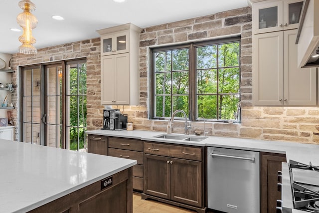 21386 Dorothy Way, Spring Lake Twp, MN 55372 - kitchen with dishwasher, light countertops, glass insert cabinets, and dark brown cabinetry