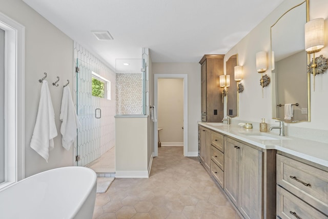 21386 Dorothy Way, Spring Lake Twp, MN 55372 - full bathroom with double vanity, a freestanding bath, a stall shower, and tile patterned floors