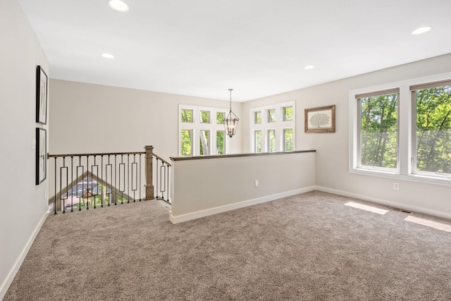 21386 Dorothy Way, Spring Lake Twp, MN 55372 - spare room featuring carpet floors, healthy amount of natural light, recessed lighting, and a chandelier