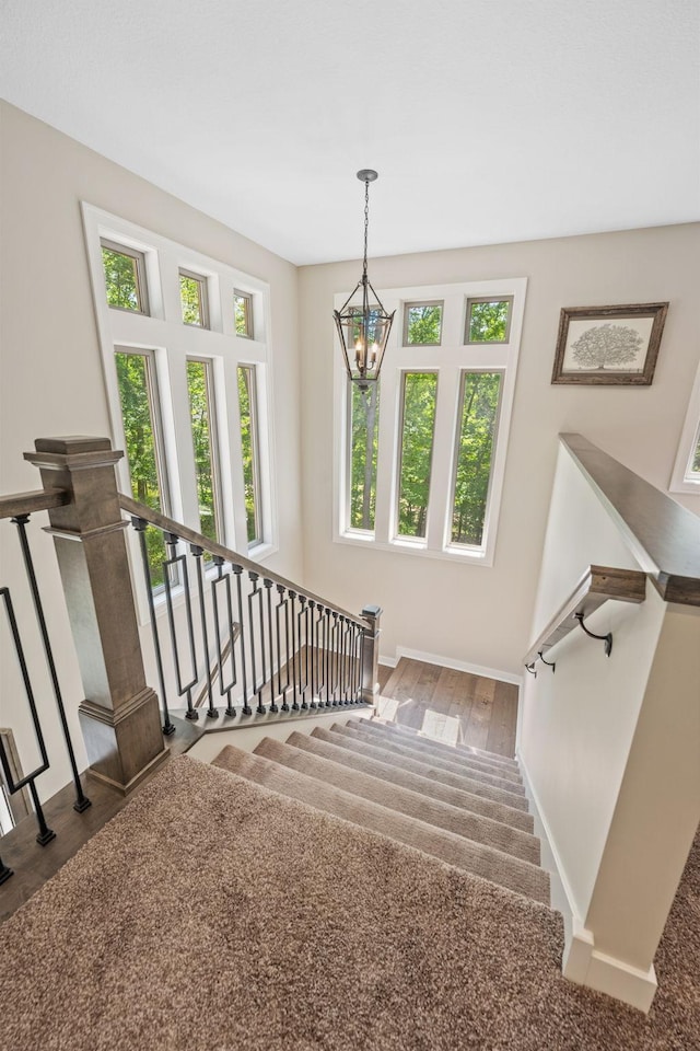 21386 Dorothy Way, Spring Lake Twp, MN 55372 - staircase with a chandelier and wood finished floors