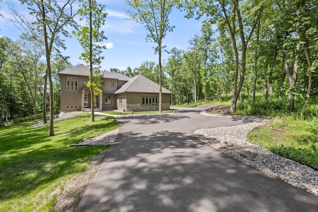21386 Dorothy Way, Spring Lake Twp, MN 55372 - view of front facade featuring curved driveway, board and batten siding, a front lawn, and stone siding