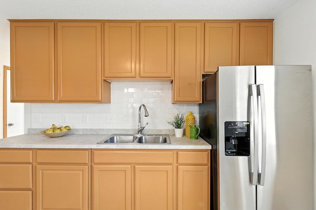 726 Thomas Ave, Saint Paul, MN 55104 - kitchen with stainless steel refrigerator with ice dispenser, light countertops, and tasteful backsplash