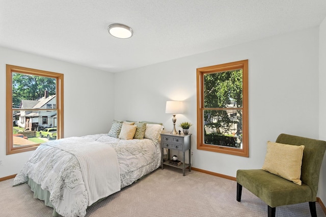 726 Thomas Ave, Saint Paul, MN 55104 - bedroom with baseboards and light colored carpet