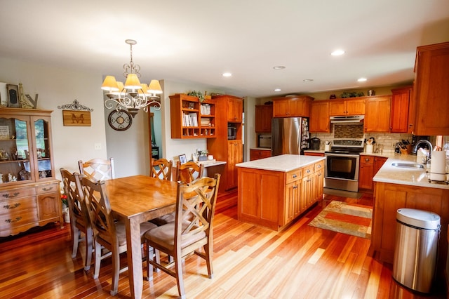 32433 Cedar St, Breezy Point, MN 56472 - dining area featuring light wood-style flooring, a chandelier, and recessed lighting