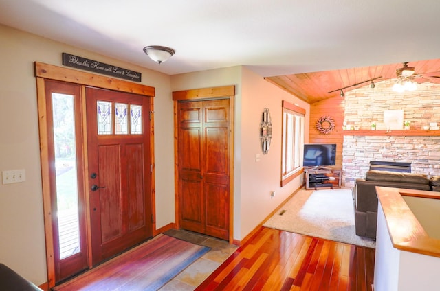32433 Cedar St, Breezy Point, MN 56472 - entrance foyer featuring light wood-style flooring, lofted ceiling, a stone fireplace, and a ceiling fan